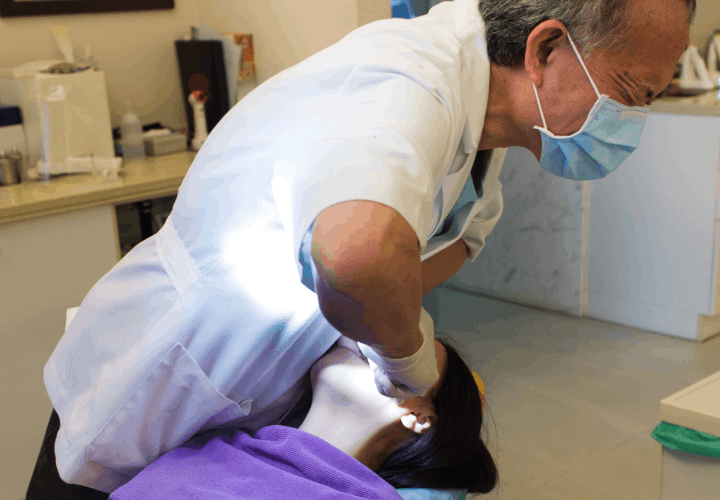 dentist performing dental procedure
